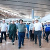 Thủ tướng Phạm Minh Chính kiểm tra thi công dự án Cảng hàng không quốc tế Long Thành (Đồng Nai). (Ảnh: Dương Giang/TTXVN)