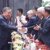 Tổng Bí thư Tô Lâm và các đại biểu tham dự buổi gặp mặt. (Ảnh: Phương Hoa/TTXVN)