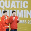 Trần Hưng Nguyên xuất sắc giành huy chương Vàng, Nguyễn Quang Thuấn giành huy chương Đồng. (Ảnh: Minh Quyết/TTXVN)