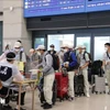 Lao động Việt Nam làm thủ tục nhập cảnh tại sân bay Incheon, Hàn Quốc. (Ảnh: Mạnh Hùng/TTXVN)