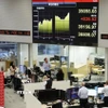 Giao dịch viên tại một công ty chứng khoán ở Tokyo, Nhật Bản. (Ảnh: Kyodo/TTXVN)