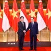 Chủ tịch Quốc hội Trần Thanh Mẫn hội kiến Thủ tướng Singapore Lawrence Wong. (Ảnh: Doãn Tấn/TTXVN)