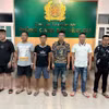Các đối tượng tại cơ quan công an. (Ảnh: Công an Đồng Nai/TTXVN phát)