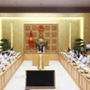 Thủ tướng Phạm Minh Chính chủ trì cuộc họp với Hội đồng Tư vấn chính sách về phát triển kinh tế tư nhân. (Ảnh: Dương Giang/TTXVN)