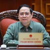 Thủ tướng Phạm Minh Chính chủ trì họp về công tác khắc phục hư hỏng công trình cầu sông Lô thuộc địa bàn xã Đoan Hùng, tỉnh Phú Thọ. (Ảnh: Dương Giang/TTXVN)