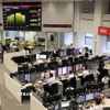 Quang cảnh phòng giao dịch tại một công ty chứng khoán ở Tokyo, Nhật Bản. (Ảnh: Kyodo/TTXVN)