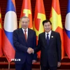 Tổng Bí thư Tô Lâm và Tổng Bí thư, Chủ tịch nước Lào Thongloun Sisoulith đồng chủ trì Cuộc gặp cấp cao giữa Đảng Cộng sản Việt Nam và Đảng Nhân dân Cách mạng Lào, tháng 12/2025. (Ảnh: Thống Nhất/TTXVN)
