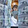 Nhân viên kiểm đếm đồng USD tại ngân hàng Hana ở Seoul, Hàn Quốc. (Ảnh minh họa: Yonhap/TTXVN)
