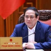 Thủ tướng Phạm Minh Chính chủ trì họp triển khai kế hoạch phân cấp, phân quyền khi thực hiện mô hình tổ chức chính quyền địa phương 2 cấp. (Ảnh: Dương Giang/TTXVN)