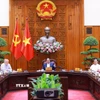 Thủ tướng Phạm Minh Chính chủ trì họp triển khai kế hoạch phân cấp, phân quyền khi thực hiện mô hình tổ chức chính quyền địa phương 2 cấp. (Ảnh: Dương Giang/TTXVN)