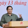 Thủ tướng Phạm Minh Chính chủ trì hội nghị khắc phục hậu quả thiên tai khu vực miền Trung. (Ảnh: Dương Giang/TTXVN)