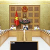 Thủ tướng Phạm Minh Chính chủ trì họp đánh giá tác động của các cuộc xung đột trên thế giới ảnh hưởng đến tình hình kinh tế-xã hội trong nước. (Ảnh: Dương Giang/TTXVN)