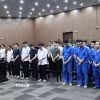 Các bị cáo nghe Tòa tuyên án. (Ảnh: Kim Anh/TTXVN)