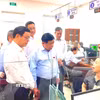 Phó Thủ tướng Nguyễn Chí Dũng kiểm tra tình hình tổ chức vận hành chính quyền hai cấp tại phường Đồng Hới, tỉnh Quảng Trị. (Ảnh: Võ Dung/TTXVN)