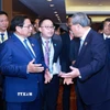 Thủ tướng Phạm Minh Chính gặp Thủ tướng Trung Quốc Lý Cường. (Ảnh: Dương Giang/TTXVN)