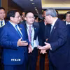 Thủ tướng Phạm Minh Chính gặp Thủ tướng Trung Quốc Lý Cường. (Ảnh: Dương Giang/TTXVN)