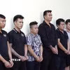 Các đối tượng tại cơ quan công an. (Ảnh: TTXVN phát)
