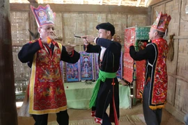 Tái hiện nghi lễ Cấp sắc của người Dao. (Ảnh: Diễm Hằng/Vietnam+)
