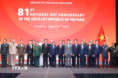 Thường trực Ban Bí thư Trần Cẩm Tú cùng các đại biểu dự Lễ kỷ niệm. (Ảnh: Phương Hoa/TTXVN)