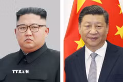 Chủ tịch Trung Quốc Tập Cận Bình (phải) và nhà lãnh đạo Triều Tiên Kim Jong Un. (Ảnh: Kyodo/TTXVN)