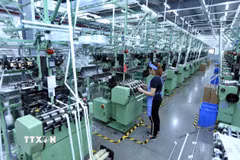 Dây chuyền sản xuất vải dệt kim tại Công ty TNHH Best Pacific Việt Nam, vốn đầu tư của Hong Kong (Trung Quốc) tại khu công nghiệp VSIP (Hải Dương). (Ảnh: Danh Lam/TTXVN)