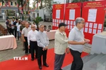 Đông đảo cử tri nô nức tham gia bỏ phiếu tại khu vực bỏ phiếu số 1, phường Xuân Hòa, Thành phố Hồ Chí Minh. (Ảnh: Thanh Vũ/TTXVN)