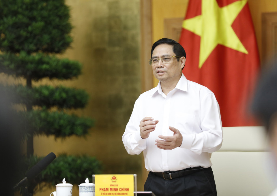 Thủ tướng Phạm Minh Chính yêu cầu Nhà nước, Nhà Khoa học, Nhà doanh nghiệp phối hợp phát triển việc nghiên cứu sản xuất vaccine phòng COVID-19.(Ảnh: Dương Giang/TTXVN) 