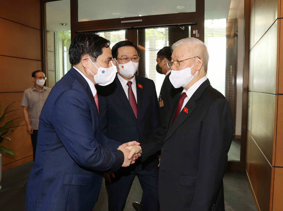 Tổng Bí thư Nguyễn Phú Trọng với Thủ tướng Phạm Minh Chính, Chủ tịch Quốc hội Vương Đình Huệ tại Lễ khai mạc.(Ảnh: Trí Dũng/TTXVN)