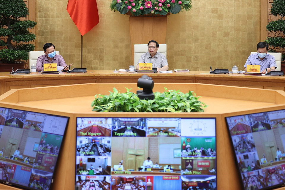Thủ tướng Phạm Minh Chính chủ trì cuộc họp với các địa phương trên cả nước về công tác phòng, chống dịch COVID-19. (Ảnh: Dương Giang/TTXVN)