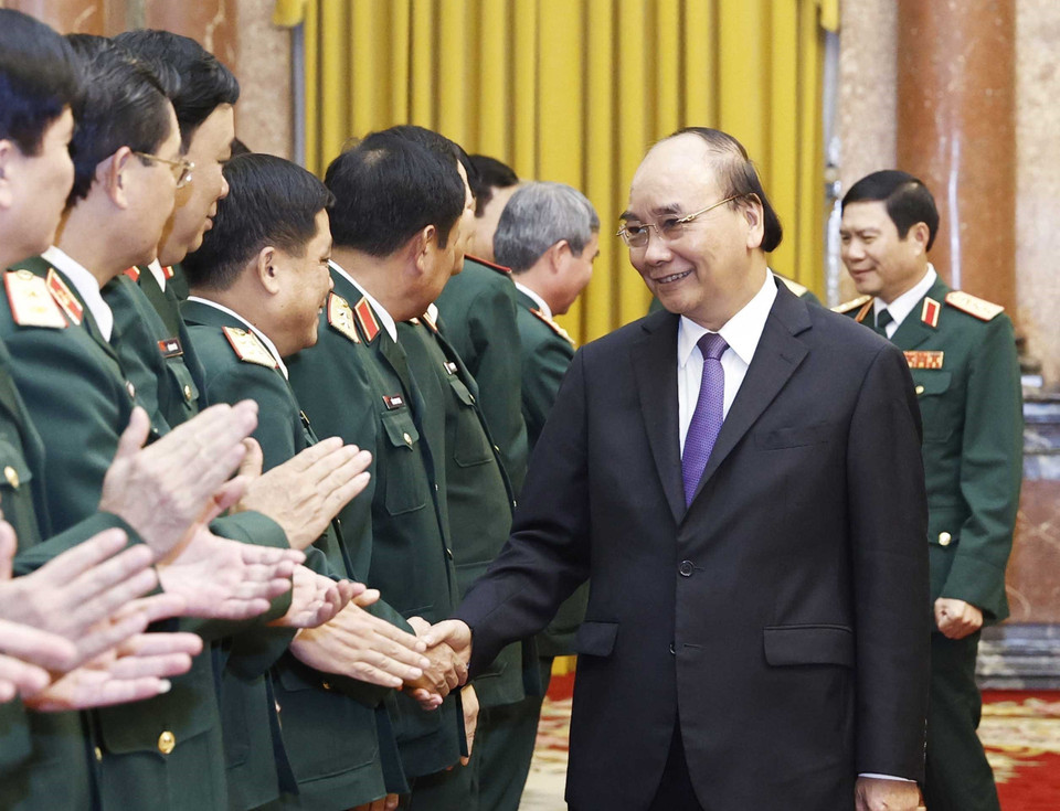 Chủ tịch nước Nguyễn Xuân Phúc và các đại biểu tham dự buổi lễ. (Ảnh: Thống Nhất/TTXVN)