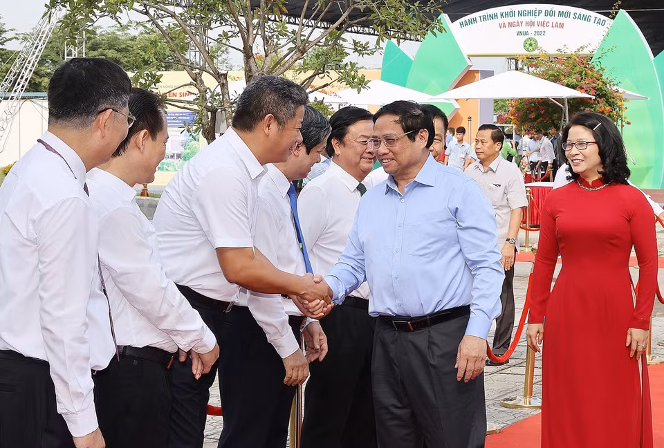 Thủ tướng Phạm Minh Chính đến dự Chương trình hành trình khởi nghiệp đổi mới sáng tạo và Ngày hội việc làm VNUA-2022. (Ảnh: Dương Giang/TTXVN)
