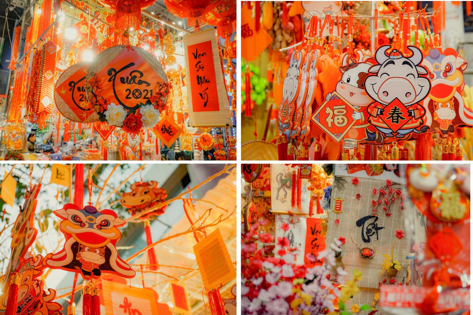 Đồ trang trí như đèn lồng, câu đối, hũ vàng, đồng tiền vàng, lì xì.... được bày bán phổ biến. (Ảnh: Minh Hiếu/Vietnam+)