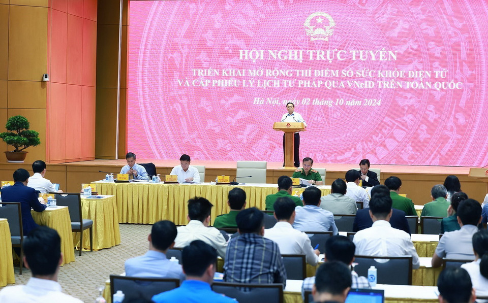 Quang cảnh Hội nghị triển khai sổ sức khỏe điện tử và cấp phiếu lý lịch tư pháp thông qua ứng dụng VNeID. (Ảnh: Dương Giang/TTXVN)