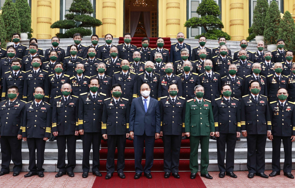 Chủ tịch nước Nguyễn Xuân Phúc với các đại biểu tại buổi gặp mặt. (Ảnh: Thống Nhất/TTXVN)