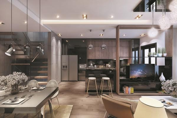 Những tầng tiếp theo sẽ là không gian sinh hoạt ấm cúng của chủ nhà. Phòng khách và nhà bếp được bố trí đơn giản với đồ nội thất chất liệu gỗ, chrome, kính... có màu sắc trung tính. Điểm nhấn là những chiếc đèn có hình khối lạ mắt phía trên.