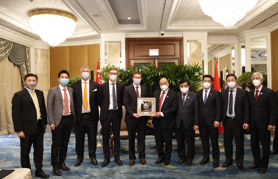 Chủ tịch nước Nguyễn Xuân Phúc tiếp các nhà đầu tư hạ tầng và tài chính quốc tế. (Ảnh: Thống Nhất/TTXVN)