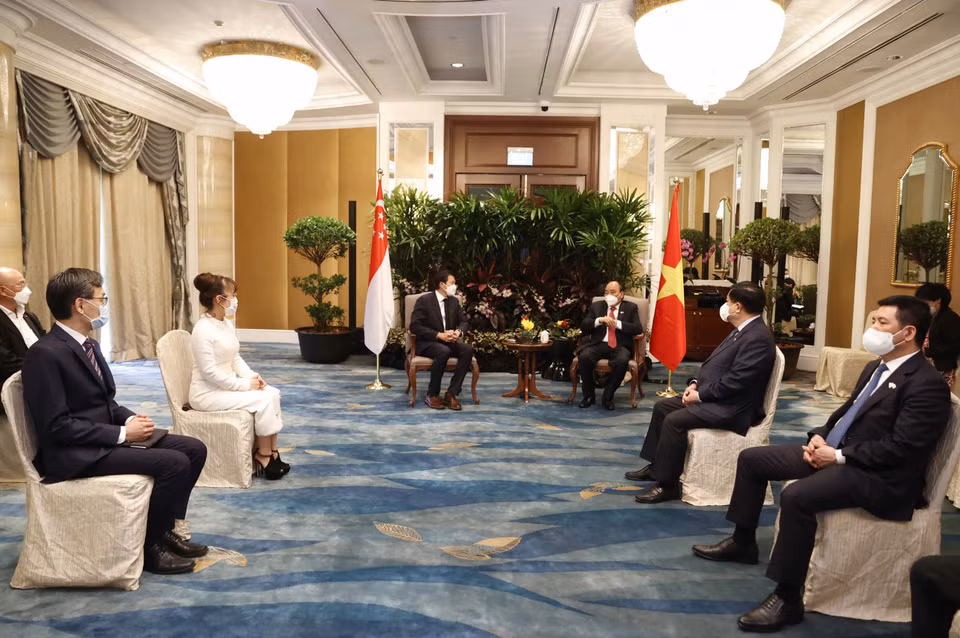 Chiều 26/2, Chủ tịch nước Nguyễn Xuân Phúc tiếp ông Lee Seow Hiang, Tổng giám đốc Tập đoàn Changi Airport (CAG). (Ảnh: Thống Nhất/TTXVN)
