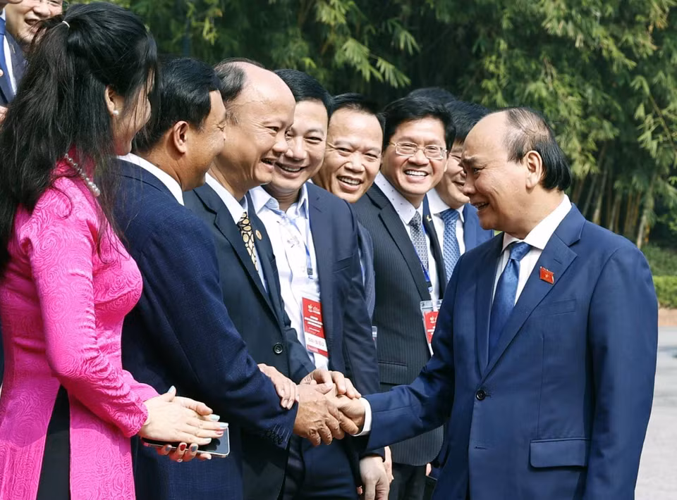 Chủ tịch nước Nguyễn Xuân Phúc với các đại biểu. (Ảnh: Thống Nhất/TTXVN)