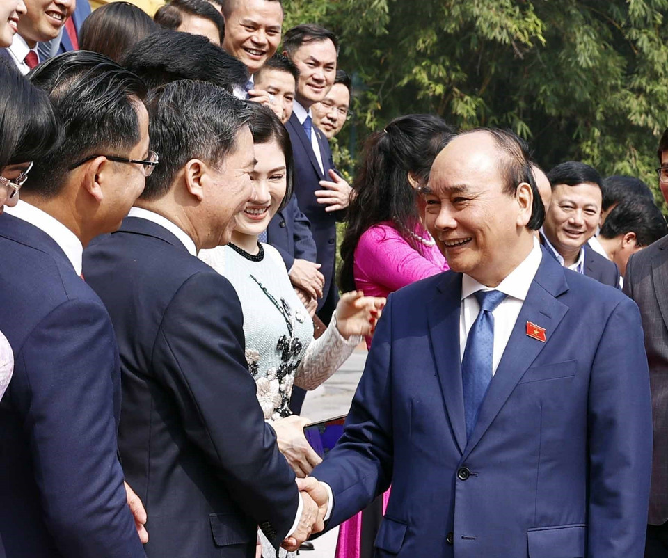 Chủ tịch nước Nguyễn Xuân Phúc với các đại biểu. (Ảnh: Thống Nhất/TTXVN)