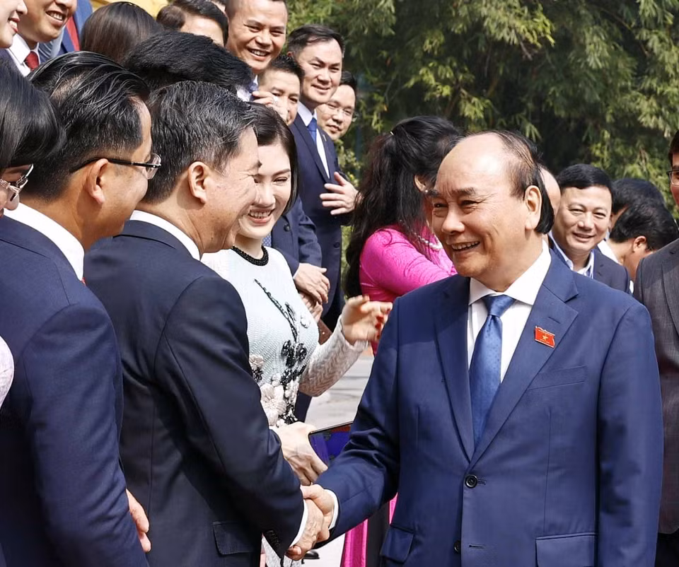 Chủ tịch nước Nguyễn Xuân Phúc với các đại biểu. (Ảnh: Thống Nhất/TTXVN)