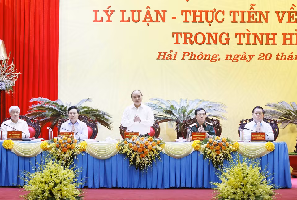 Chủ tịch nước Nguyễn Xuân Phúc chủ trì hội thảo. (Ảnh: Thống Nhất/TTXVN)