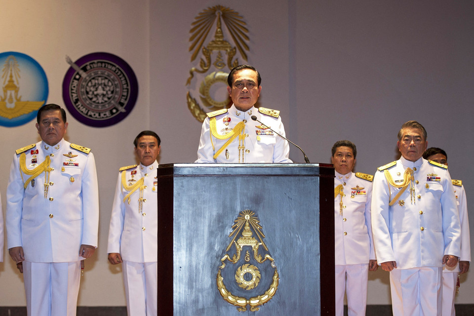  Ông Prayut Chan-o-cha, khi đảm nhiệm cương vị Tổng Tư lệnh quân đội Thái Lan, trong cuộc họp báo tại Bangkok ngày 26/5/2014. (Ảnh: AFP/TTXVN)