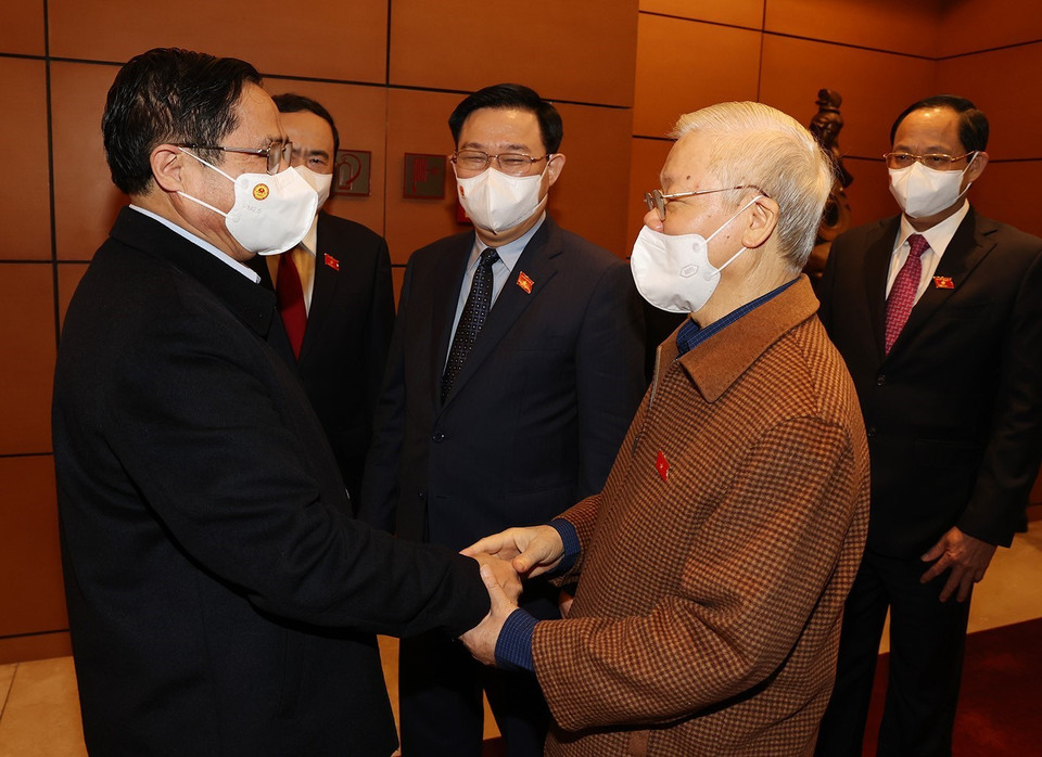 Tổng Bí thư Nguyễn Phú Trọng, Thủ tướng Chính phủ Phạm Minh Chính, Chủ tịch Quốc hội Vương Đình Huệ cùng các lãnh đạo Đảng, Nhà nước dự Kỳ họp thứ hai, Quốc hội khóa XV. (Ảnh: Trí Dũng/TTXVN)