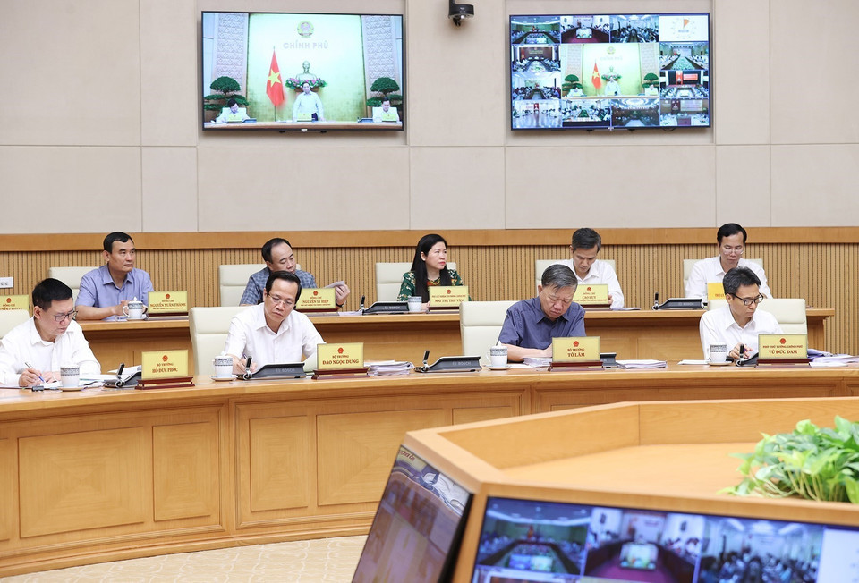 Thành viên Chính phủ và đại diện các cơ quan thuộc Chính phủ tham dự hội nghị. (Ảnh: Dương Giang/TTXVN)