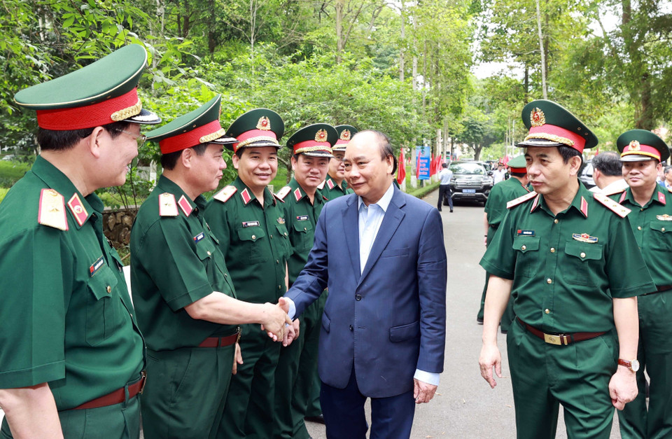 Chủ tịch nước Nguyễn Xuân Phúc với các đại biểu tham dự buổi lễ. (Ảnh: Thống Nhất/TTXVN)