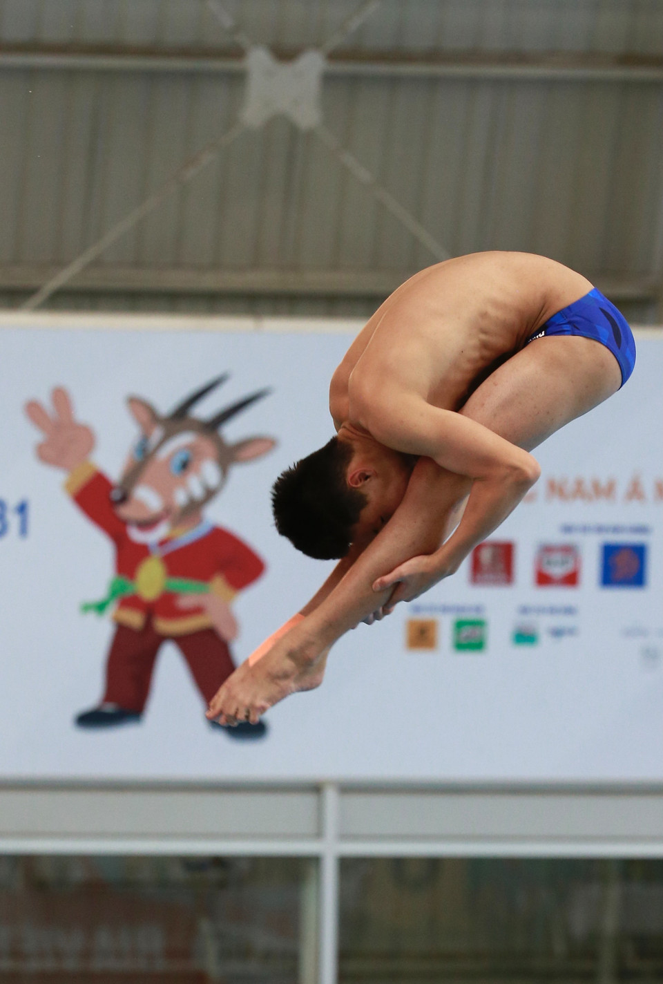 Phần thi đấu của vận động viên Việt Nam Đinh Anh Tuấn nội dung Đơn nam cầu mềm 3m. (Ảnh: Trọng Đạt/TTXVN)