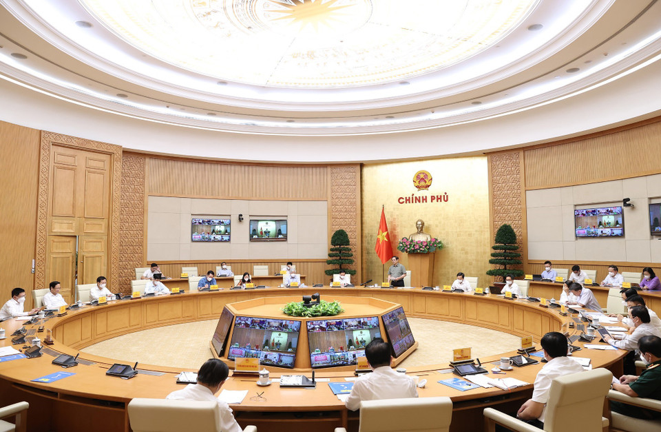 Quang cảnh cuộc họp trực tuyến tại điểm cầu Chính phủ. (Ảnh: Dương Giang/TTXVN)