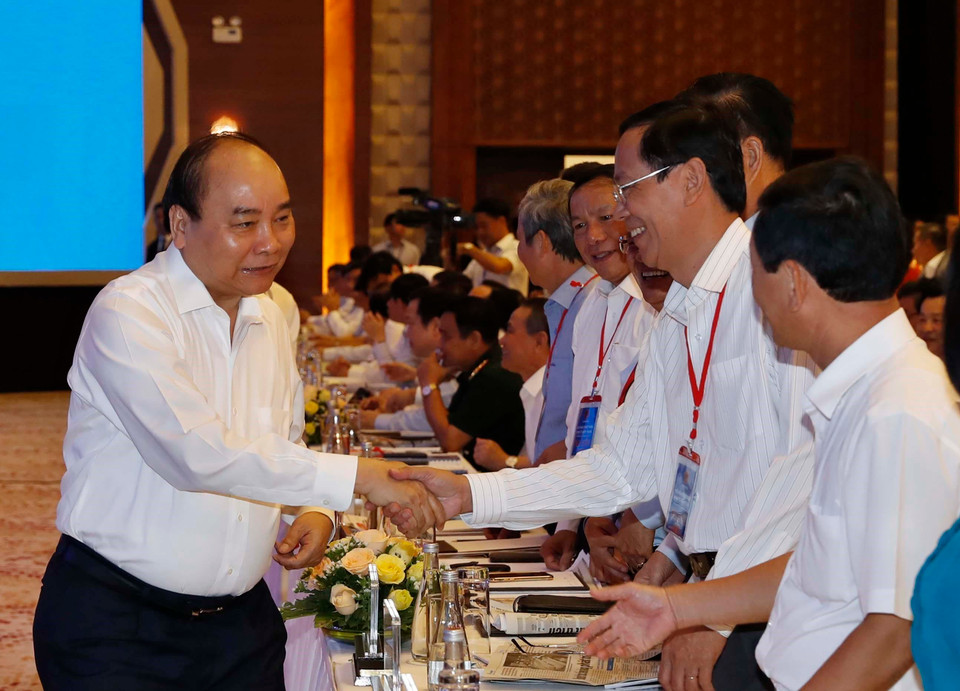Thủ tướng Nguyễn Xuân Phúc với các đại biểu dự hội nghị. (Ảnh: Thống Nhất/TTXVN)