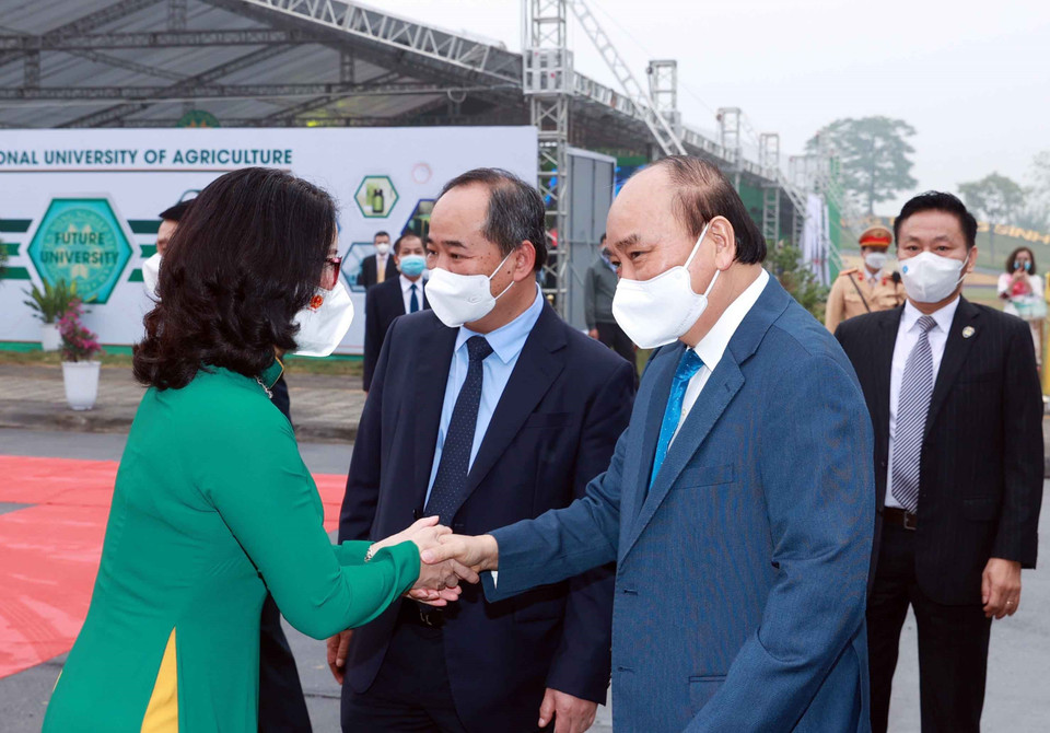 Chủ tịch nước Nguyễn Xuân Phúc đến dự Lễ kỷ niệm Ngày Nhà giáo Việt Nam 20/11 và khai giảng năm học mới 2021-2022 của Học viện Nông nghiệp Việt Nam. (Ảnh: Thống Nhất/TTXVN)