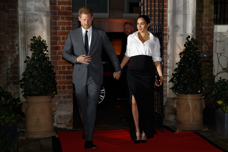  Hoàng tử Anh Harry (trái) và nữ Công tước Meghan tại một sự kiện ở London ngày 7/2/2019. (Ảnh: AFP/TTXVN)